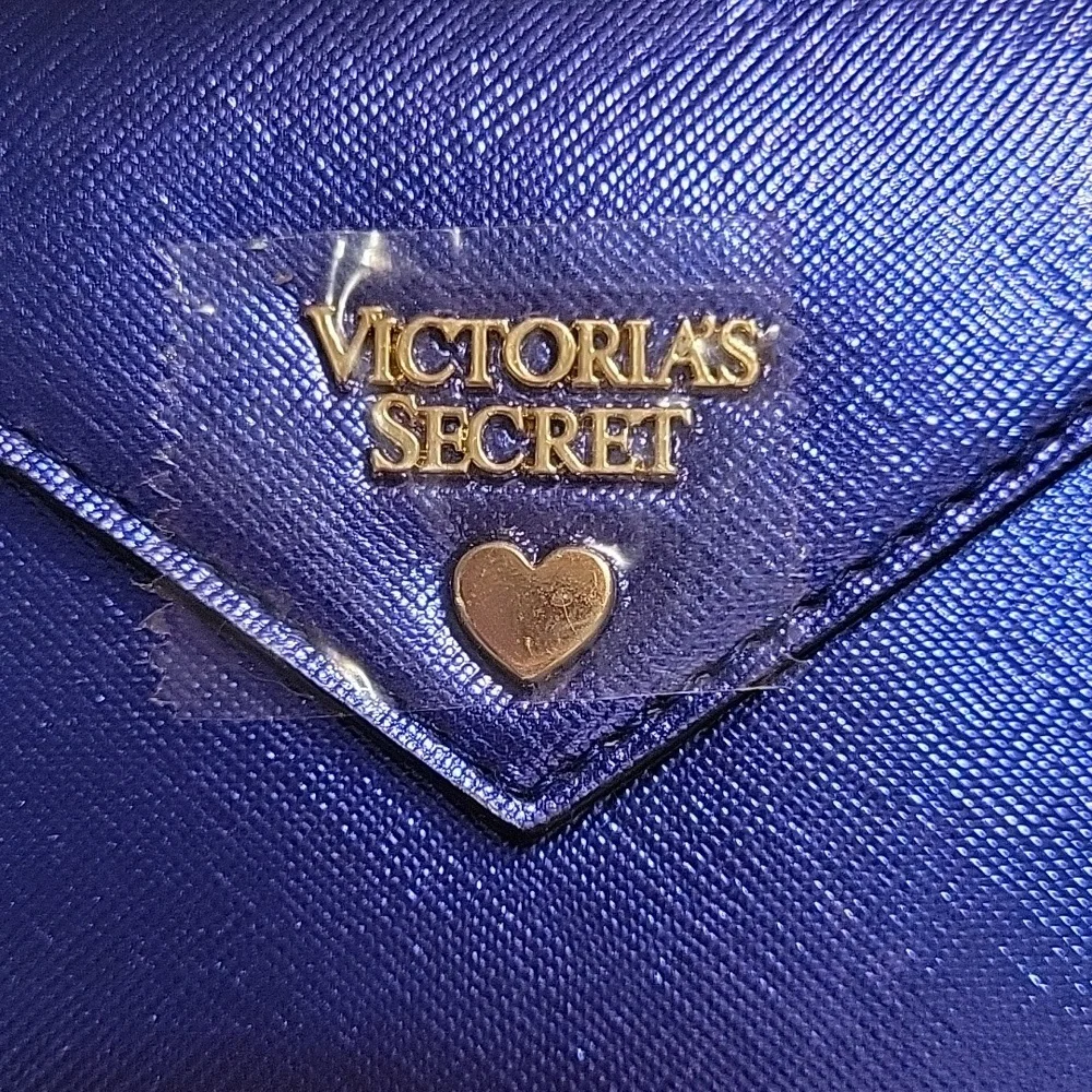 Victoria's Secret Jewel Envelope Pouch Wallet in metallic royal blue.‎ NWT.